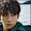 ranalore: Zhu Yilong sitting on a pier with ocean behind (zhu yilong pier)