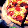 leesa_perrie: icon of a slice of pepperoni pizza on a wooden plate (Pizza)