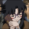 flamebyrd: A woman pressing a book to her face with a very happy expression. (books)