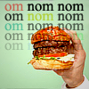 tropicsbear: Picture of a hand holding a burger with the words "om nom nom nom ..." over it (Food: om nom nom burger)