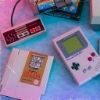 tozka: a gameboy, nes controller and nes cartridge (video games from the 1990s)