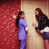 challyzatb: Amy and Rita from Doctor Who stand at a cream door; the wallpaper is reddish. (doorritaamy)