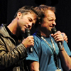 em_kellesvig: Joe Flanigan snuggling against David Hewlett at a convention and David has a wrinkled nose as Joe hugs him. (JFDHSnuggles)