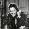 theboredreader: From the movie His Girl Friday (1940), Rosalind Russell smiling as she talks on the phone (Default)