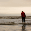 monksandbones: A photo from behind of me standing in the waves at Long Beach, Pacific Rim National Park Reserve, looking at my feet (you stand humbled at the ocean's door)