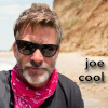 em_kellesvig: Joe Flanigan in sunglasses and a red neckerchief, looking totally cool. (jfjoecool)