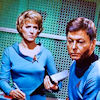 chanter1944: Chapel with binder and stylus in hand, looking at a closer-to-camera McCoy (TOS - Chapel and McCoy: and guard life)