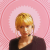 teaotter: Parker, wearing a headset, in front of a pink background (Parker in pink)