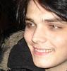 frausorge: Gerard Way in a jacket with faux fur trim on the hood, looking to the side with a slightly pained smile (the way out is through)