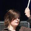 frausorge: Spencer Smith with long bangs covering his eyes, with one hand raised holding a drumstick (every time I see you)
