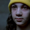 halfwitch: little girl in a yellow hat, staring forward (Of all things we can overcome.)