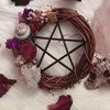 witchofthebough: A pentacle floral wreath atop a white tablecloth which is adorned by rose petals and a moth. (Pentacle Round)