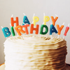 bunnyboo: A cake with candles that spell out "Happy Birthday" (happy birthday)