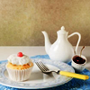 cassildra: (tea: with cupcake)