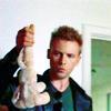 esteefee: Ray Kowalski wearing a quizzical expression and a green shirt and black leather jacket holding up a stuffed bunny. (bunny)