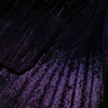 queen_butterfly: macro shot of a black butterfly wing with a streaky dark purple pattern (butterfly)