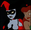 voleuse: A woman dressed in a red and black harlequin costume with white face makeup and a red-headed woman beside her (cartoon | tas)