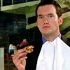 thalia: Ianto Jones eating pizza with napkin bib (tw - pizza!ianto)