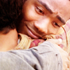 gloss: handsome guy has a lot of feelings as he hugs someone (Community: Troy hug)