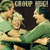 chokolattejedi: Picture of BJ, Hawkeye, and Margaret from MASH laughing and hugging each other, text "Group Hug!" (MASH - Group Hug)