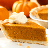 chokolattejedi: Picture of a slice of pumpkin pie with whipped cream on top, the rest of the pie and some small pumpkins unfocused in the background (Fall - Pumpkin Pie)