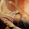 satsuma: a closeup of a pair of leather boots (boots)