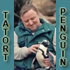 amedia: Sandy-haired man in zoo uniform smiling while holding a happy penguin. Caption: TATORT PENGUIN (Tatort Muenster 2)