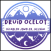 thedruidocelot: photo of a logo in purple and white that says "druid ocelot, disabled jeweler, he/him/his" on it with a ring of mountains. (druidocelotpfp)