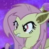 biddyfox: Flutterbat from My Little Pony: Friendship is Magic. a yellow, cute pony with a pink mane, sharp fangs and bat wings. (grumpy)