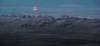 aunty_marion: Screenshot of moon over Icelandic mountain range (Iceland moon)