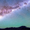 reeby10: space in mostly blues and purples with a silhouette of ground at the bottom (space)
