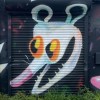 pallas_rose: Graffiti of a mouth-open, smirking possum face (Default)