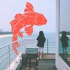 chawlla_no_ko: child overlooking the ocean and an illustrated fish jumping (Default)