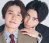 dorinda: Nozue is smiling slightly, head cocked to one side, as Togawa holds him from behind, looking determined. (old fashion cupcake - holding)
