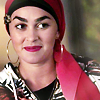 muccamukk: Marjan smiles like she's trying not to laugh, glancing sideways. (Lone Star: Marjan Smile)