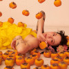 furniished: japanese breakfast (michelle zauner) lying down surrounded by persimmons (jbrekkie)