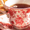sixbeforelunch: closeup image of a red and white teacup, no text (stock - tea)