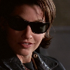 blueshiftofdeath: corky from bound wearing sunglasses and smirking (sunglasses smirk)