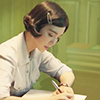 sakanawords: picture of a woman writing at a desk (xiaoman-writes4)