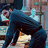 magicalarchaeologist: (leaning over books)