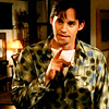 turlough: young man in hideous green-patterned shirt with rised finger, Xander from 'Buffy the Vampire Slayer' ((buffy) excuse me?)