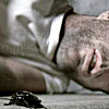 anatsuno: close-up of Sylar (unrecognizable) lying dead on the floor, a cockroach in the foreground (death warmed over)