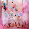 ai: two sylveon plushies resting on a pink lamp stand (sylveon)