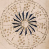 fic_index: A centered close up of a diagram from the Voynich Manuscript. It shows a sixteen-pointed flower with white-and-indigo petals, a multitude of tiny six-pointed stars, and text in a flowing script circling framing it all. (community default)