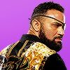 flowersforgraves: Rocky Romero (NJPW, CHAOS) looking over his shoulder toward the camera, wearing a black & gold jacket. (wrestling: rocky)