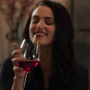 deathsmajesty: Katie McGrath (Wine - Amused Smile)