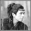 amedia: Black and white image with a white border of a young man (Da Qing) in old-fashioned Chinese garb (Guardian: DQ2)