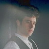 van_champion: A man standing in a light effect at a nightclub. (pretentions)