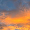glassesofjustice: photograph of clouds with a bright orange sunset on the lower half (Meta:Clouds)