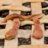 squaremeals: A pi symbol made of pastry on top of a fruit pie (Default)